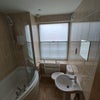 Photo 3: Toilet and shower.