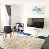 Photo 8: Large TV, 3 seater sofa + dining table seats 3-4