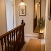 Photo 2: Cozy Warm-Toned Hallway Landing