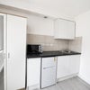 Photo 7: Fridge freezer, toaster, kettle, microwave and induction plug in hob provided.
