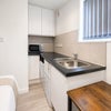 Photo 5: Fridge freezer, toaster, kettle, microwave and induction plug in hob provided.