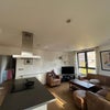Photo 3: Living area and open plan kitchen