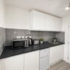 Photo 8: Fridge freezer, toaster, kettle, microwave and induction plug in hob provided.