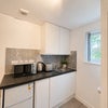Photo 7: Fridge freezer, toaster, kettle, microwave and induction plug in hob provided.