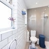 Photo 4: A bright, clean and modern bathroom with a shower and fresh towels.