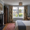 Photo 3: AI-staged to show planned furnishing – room, fireplace, wall colour, curtains and rug are as shown