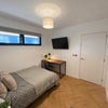 Photo 2: Bedroom with desk and TV