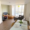 Photo 2: Living room with access to the private patio