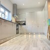 Photo 6: Communal Kitchen and Living Area