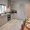 Photo 8: Communal Kitchen and Living Area
