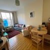 Photo 2: Living and dining room (window getting fixed)