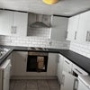 Photo 5: Bright, fully equipped kitchen