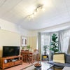 Photo 3:     Living room — Bright, spacious living and dining room with large character windows