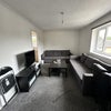 Photo 2: Living room with 2 sofa beds