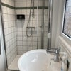 Photo 7: Downstairs shower, basin, wc.