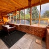 Photo 2: Covered outdoor seating area with view of garden which is not overlooked