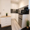 Photo 4: Fridge freezer, toaster, kettle, microwave and induction plug in hob provided.