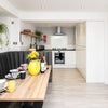 Photo 11: Communal Kitchen and Living Area