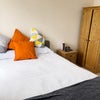 Photo 2: Double bedroom with wardrobe and bedside storage