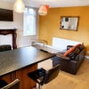 Photo 4: Comfortable shared lounge with TV