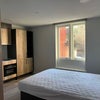 Photo 2: bed and kitchen