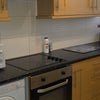 Photo 6: Kitchen with washing machine, dryer
