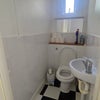 Photo 6: Upstairs Toilet