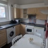 Photo 7: Kitchen with washing machine and appliances