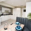Photo 13: Communal Kitchen and Living Area
