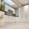 Photo 10: Communal Kitchen and Living Area