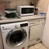 Photo 8: washing machine and tumble drier in separate utility room