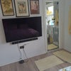 Photo 2: TV opposite bed
