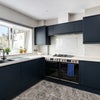 Photo 7: Communal Kitchen and Living Area
