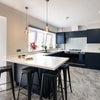 Photo 8: Communal Kitchen and Living Area