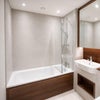 Photo 2: Your own bathroom with lots of storage space in mirrored cabinets 