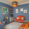 Photo 2: Cosy shared sitting room off kitchen