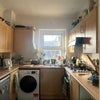 Photo 3: Kitchen! Has a brand new oven and a washing machine. Ample closet space. 