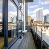 Photo 4: Balcony with views across Leeds