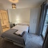 Photo 6: Bedroom 5 - en-suite with balcony to front