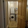 Photo 5: Separate quiet laundry room.