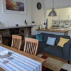 Photo 9: View from front of living room towards Kitchen