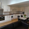 Photo 2: Kitchen and communal area