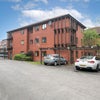 Photo 2: View of the block and parking