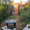 Photo 8: garden, top-left window is Room 2