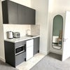 Photo 3: Fridge freezer, toaster, kettle, microwave.