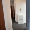 Photo 2: Corridor Facing Entrance 
