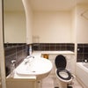 Photo 16: bathroom shared by 1 more only