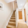 Photo 7: Internal staircase showing duplex layout