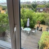 Photo 3: view over garden from room