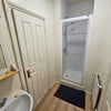 Photo 2: attached shower (excludes toilet)